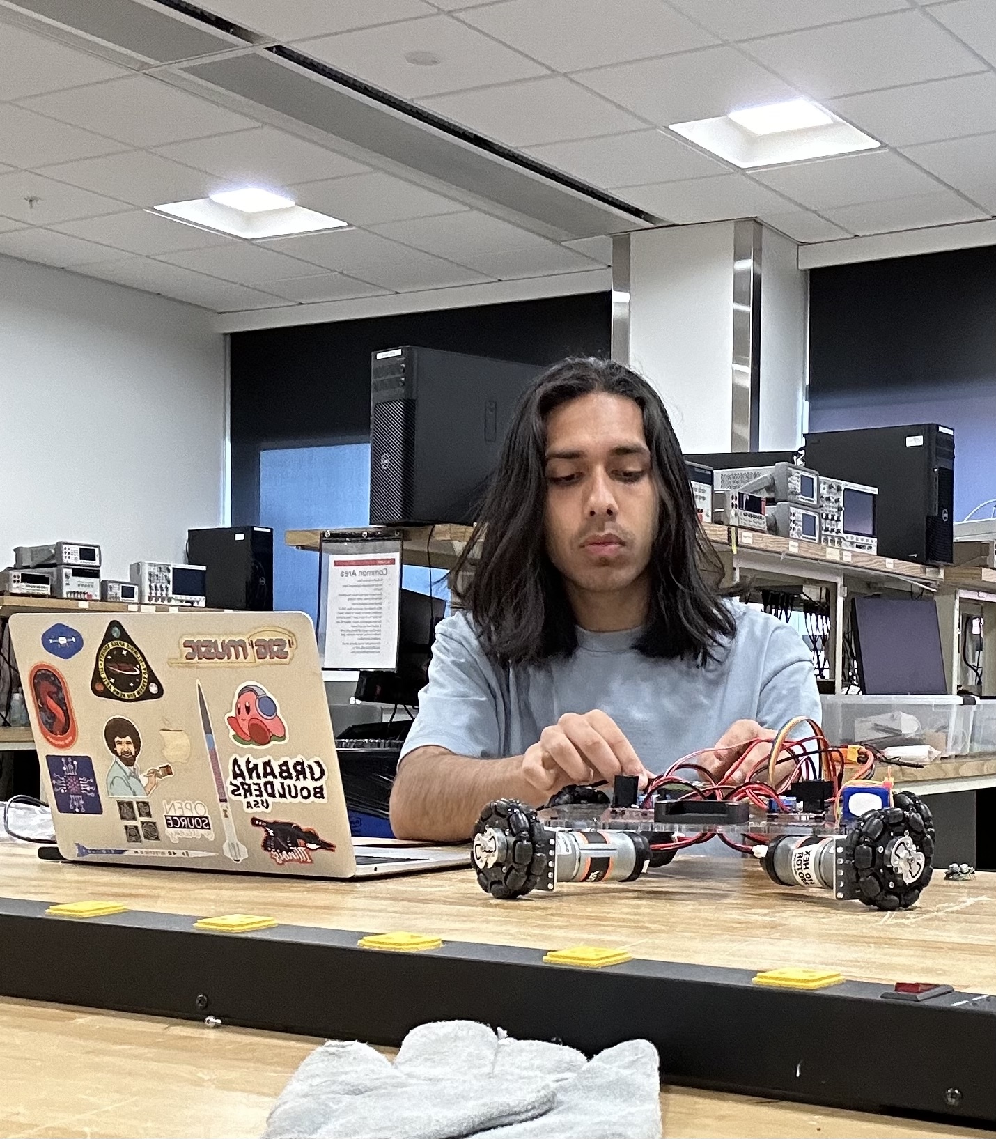 Gautam Dayal prototyping a robot for his exhibit at Engineering Open House at UIUC in April 2024